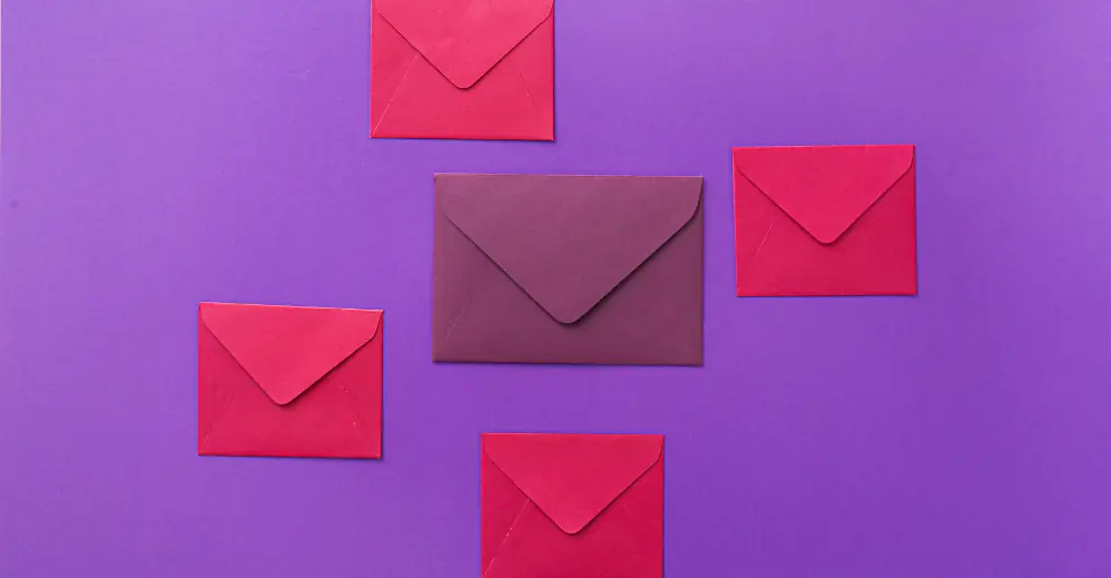 Healthcare marketing consultation Dubai: Red and purple envelopes on a violet background beside the consultation request form