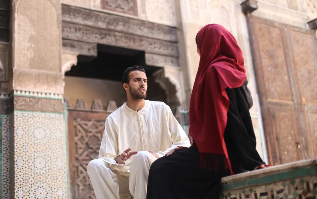 Fertility clinic SEO UAE: Couple talking in a courtyard for the fertility clinic SEO patient-journey section, supporting IVF search intent and treatment-page SEO