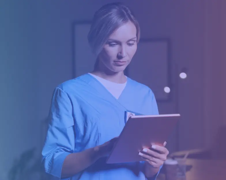 Medical and dental marketing in UAE: Healthcare professional in blue scrubs reviewing a folder for Single-Specialty Clinic Groups