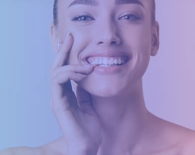 Medical and dental marketing in UAE: Smiling woman touching her cheek in the smile-makeover section, supporting specialty-led healthcare marketing