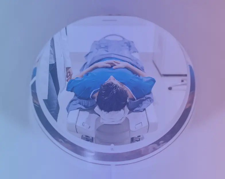 Medical and dental marketing in UAE: Person positioned on a medical imaging scanner table, supporting diagnostic centre marketing
