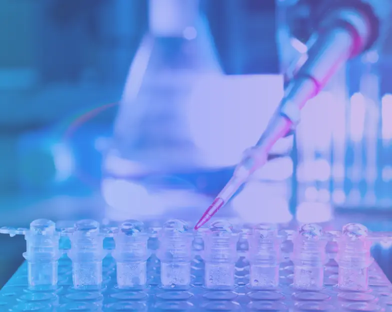 Medical and dental marketing in UAE: Pipette held above a row of small laboratory sample containers for Specialist Diagnostic Services, supporting specialty-led healthcare marketing