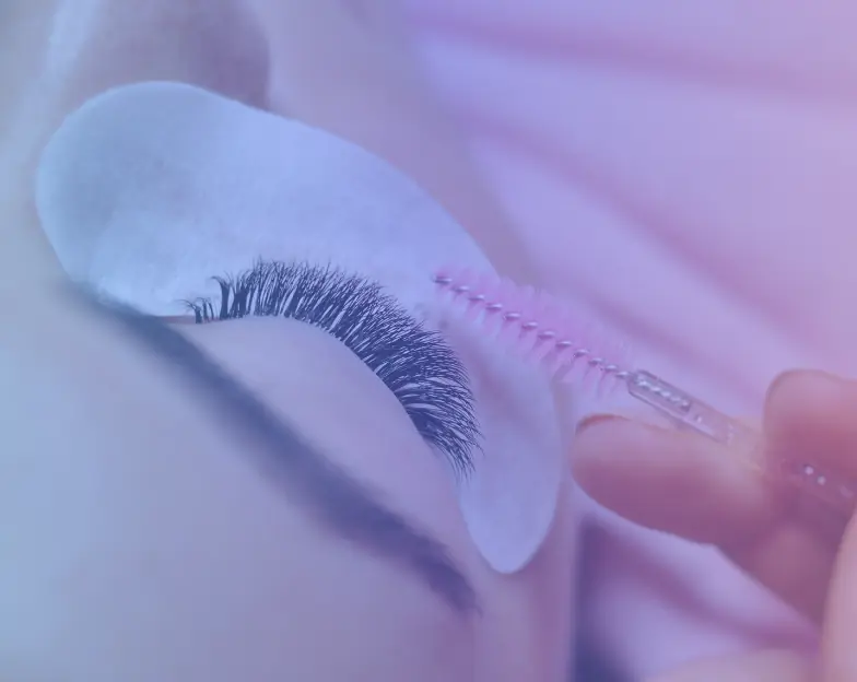 Medical and dental marketing in UAE: Close-up of eyelash grooming with a small brush for Brows, Lashes and Beauty Studios