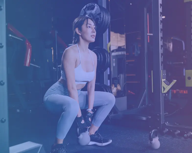 Medical and dental marketing in UAE: Woman exercising with weights in a gym for Full-Service Gyms and Health Clubs, supporting fitness and wellness marketing UAE