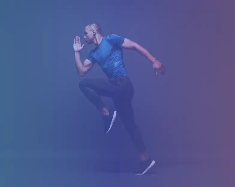 Medical and dental marketing in UAE: Man performing a running drill against a dark background for Sports and Training Academies, supporting fitness and wellness marketing UAE