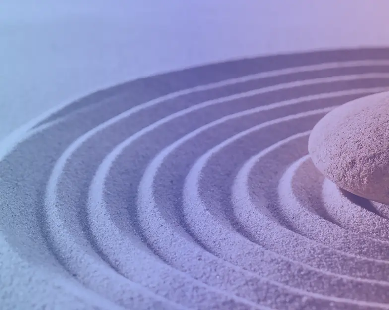 Medical and dental marketing in UAE: Raked sand and smooth stones in a wellness still life for Integrated Wellness Centres, supporting fitness and wellness marketing UAE