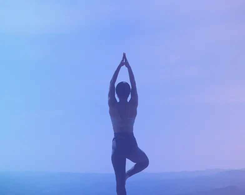 Medical and dental marketing in UAE: Silhouette of a person holding a one-legged exercise pose outdoors for Lifestyle and Wellness Programmes, supporting fitness and wellness marketing UAE