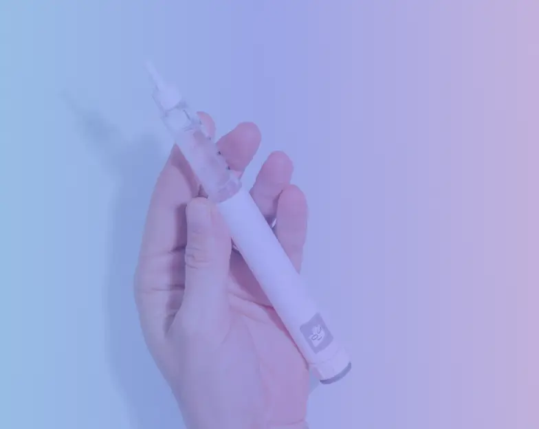 Medical and dental marketing in UAE: Hand holding an injection pen in the clinician-led longevity tile for Medically Led Longevity Clinics, supporting fitness and wellness marketing UAE
