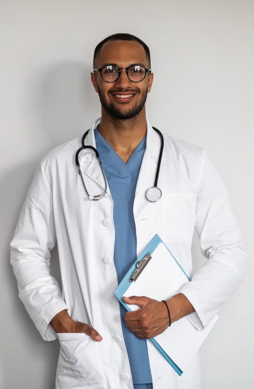 Healthcare marketing packages UAE: Clinician in a white coat holding a folder in the Value plan section, supporting paid media and patient acquisition